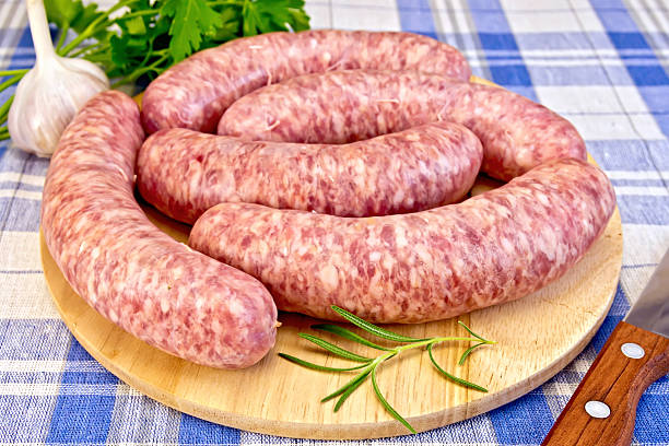 istock Sausages pork on blue cloth 509255029