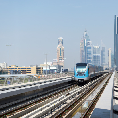 Dubai, United Arab Emirates - March 28, 2014: Train approaching Jumeirah Lakes Tower metro station. 