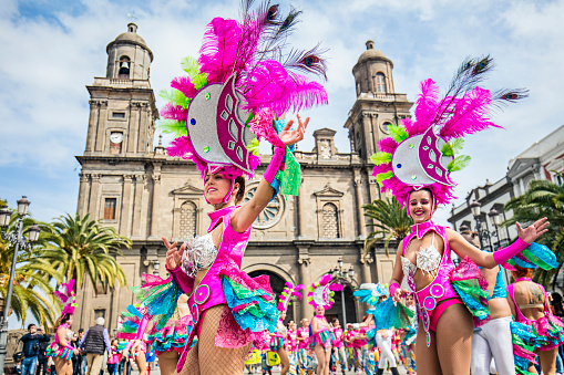 Las Palmas de Gran Canarias, Spain - February 6, 2016: Group of Youngsters dancing in Plaza de Santa Ana with Cathedral in the background for Carnivals. 