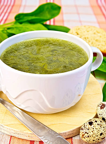 istock Soup of greenery on fabric with quail eggs 509273697