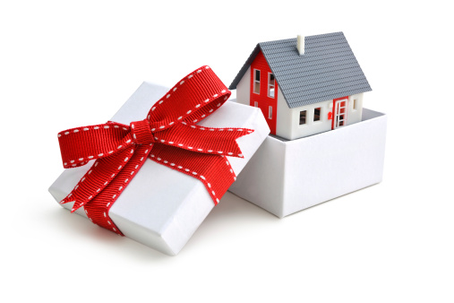 House model in gift box with red ribbon