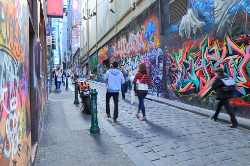 Melbourne Australia - August 23, 2014: Tourists sightsee graffiti on Hoiser lane Melbourne downtown