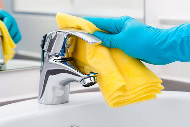 Cleaning Tap Woman doing chores in bathroom, cleaning tap domestic bathroom stock pictures, royalty-free photos & images