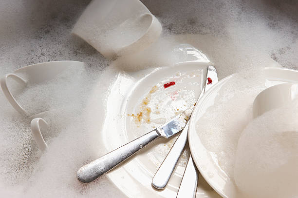 istock Stack Of Dirty Dishes And Silverware In Sink With Bubbles 509278557