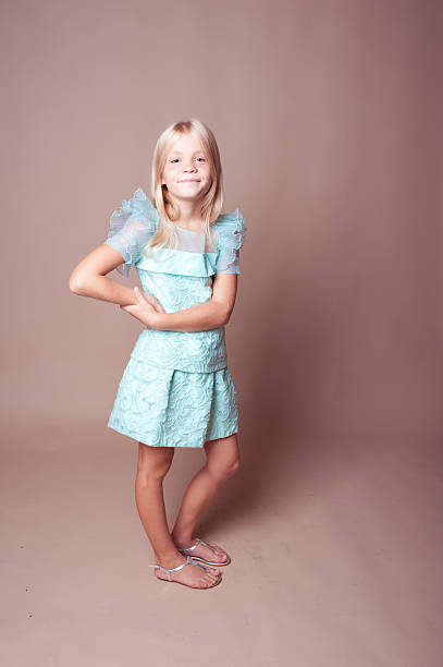 istock Smiling kid girl posing over brown 509278951