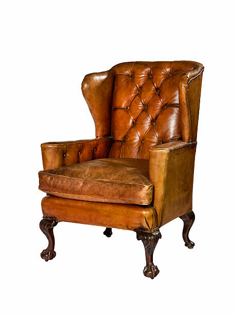 istock antique leather wing chair carved legs isolated with clip path 509287802