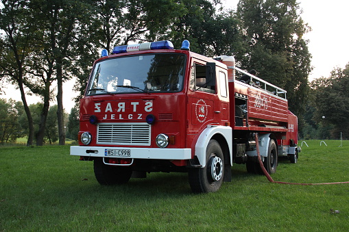 Wodynie, Poland - August 23th, 2011: Jelcz 315 firetruck stopped on the grass.This truck was one of the most popular firetrucks in Poland.