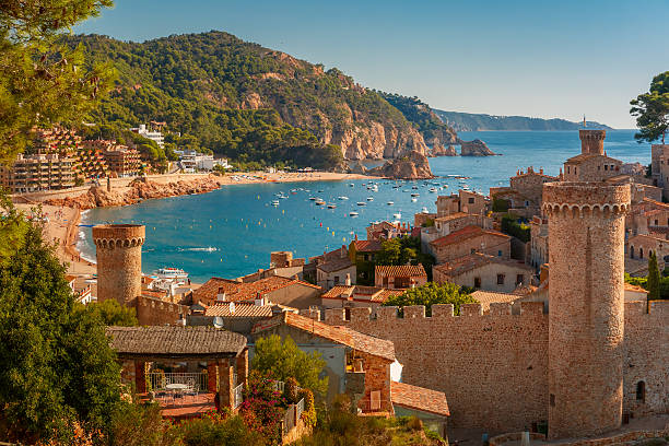 Tossa de Mar on the Costa Brava, Catalunya, Spain Aerial view of Fortress Vila Vella and Badia de Tossa bay at summer in Tossa de Mar on Costa Brava, Catalunya, Spain medieval architecture stock pictures, royalty-free photos & images
