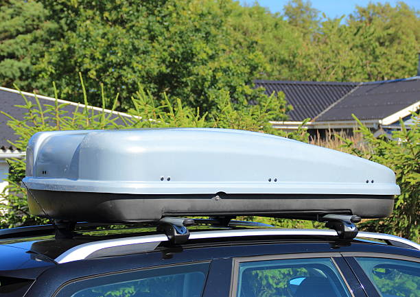 istock Roof box on car with tree background 509289291
