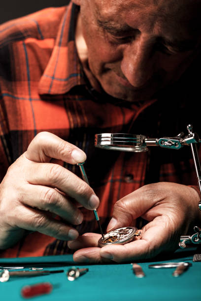 istock Repairing old pocket watch 509290241