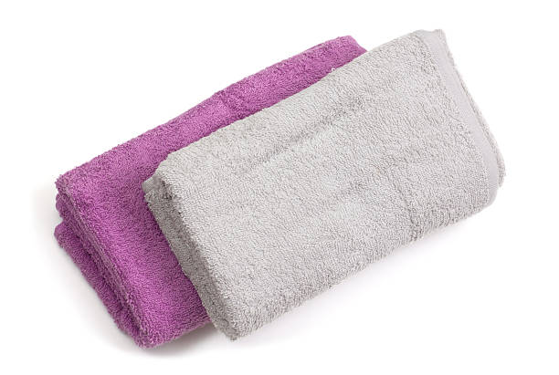 istock Towels and piece of soap isolated on white background 509290336