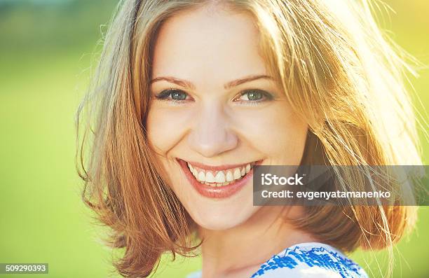 Happy Beautiful Young Woman Laughing And Smiling On Nature Stock Photo - Download Image Now