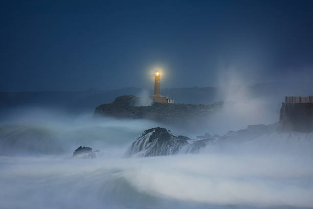 Mouro lighthouse in Santander at night stock photo
