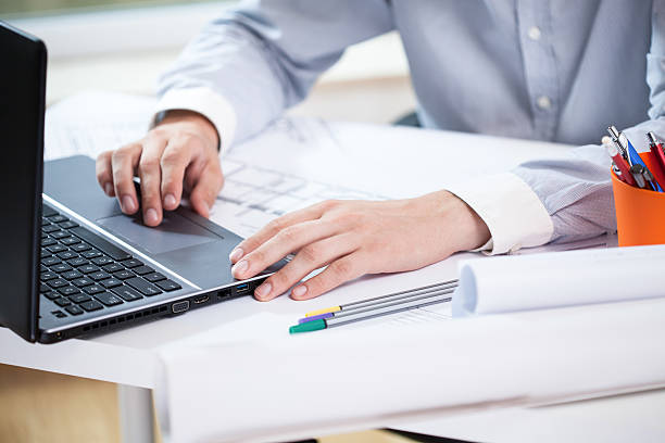istock Close-up of architect working on laptop 509291375