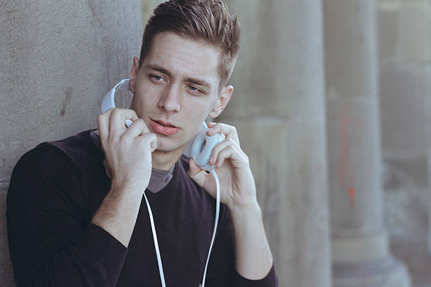 istock attractive guy with headphones in the city 509291656