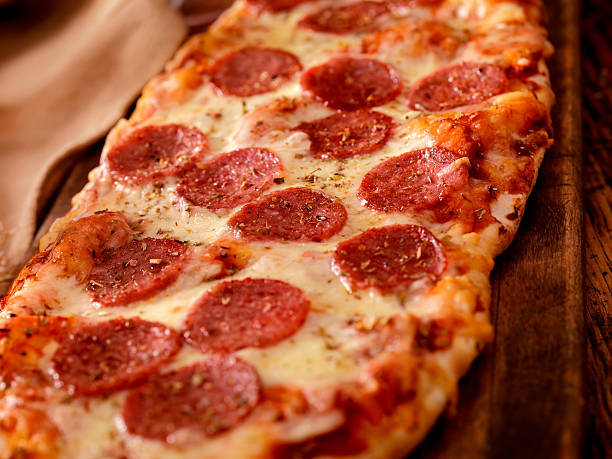 Flatbread Pizza Pepperoni Flatbread Pizza -Photographed on Hasselblad H3D2-39mb Camera flatbread stock pictures, royalty-free photos & images
