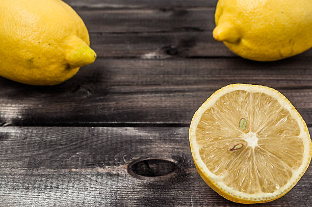 istock Fresh lemon fruit on wooden background. 509293244