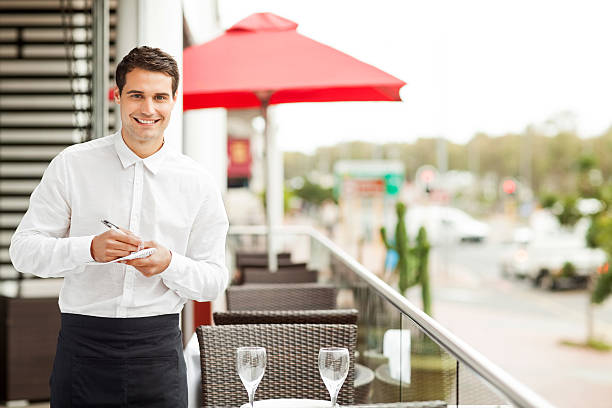 istock Waiter With Pen And Order Pad Smiling In Restaurant 509296531