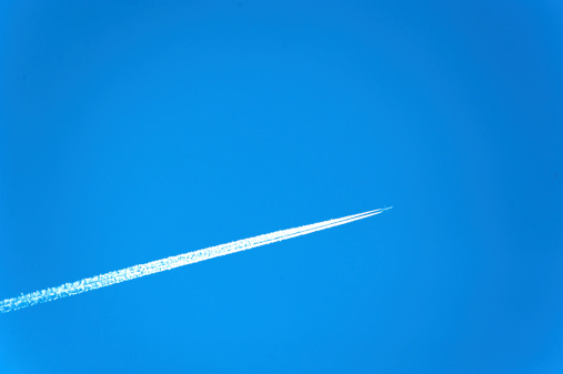 Jet contrail in a blue sky.