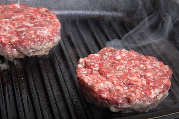 istock Fresh meat cutlets in a frying pan grill 509297146