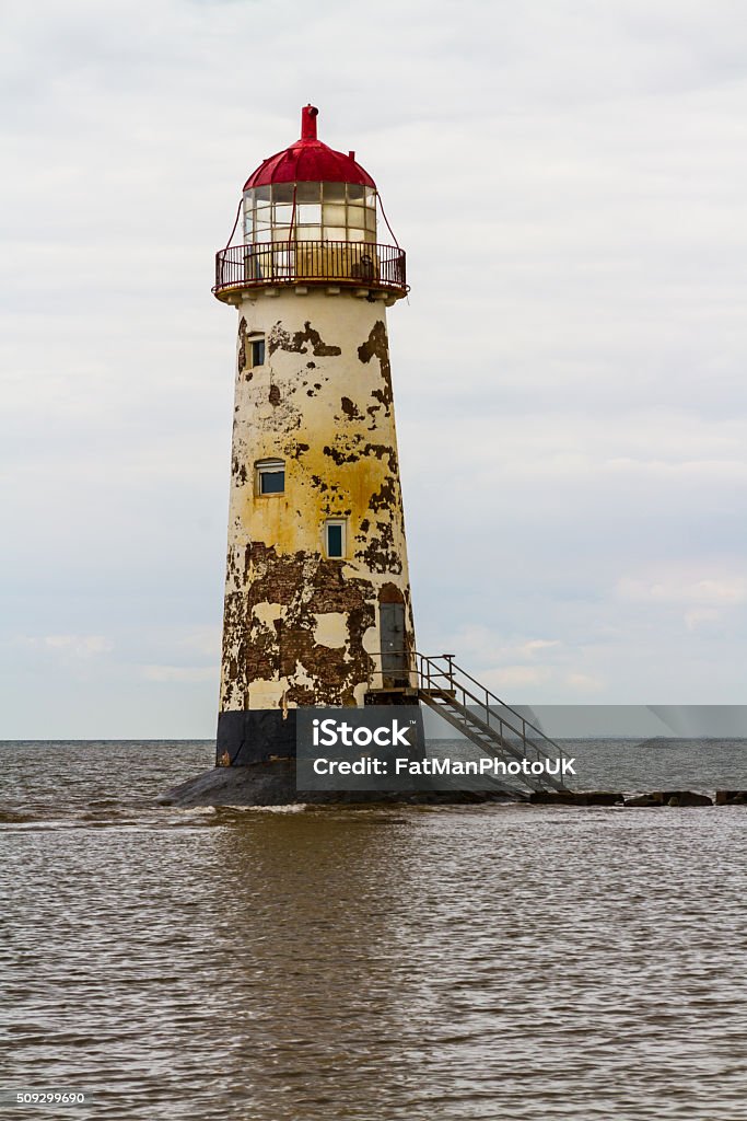 Point of Ayr Lighthouse. Point of Ayr derelict lighthouse, on the most northern tip of Wales. Talacre, Flintshire, United Kingdom. House Stock Photo