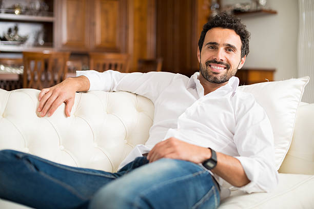 istock Man relaxing on the couch 509300362