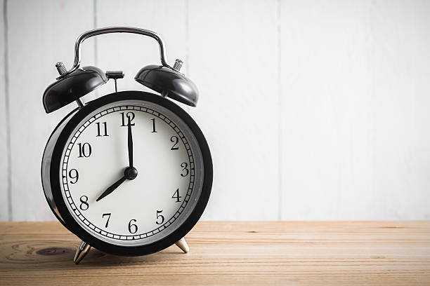 istock Still life with vintage alarm clock on wood table 509300882
