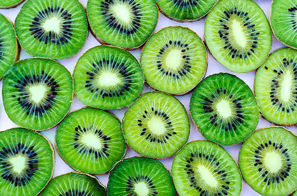 istock Bright green slices of kiwi fruit as a background 509303214