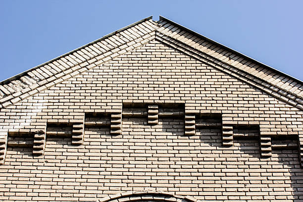 istock Old brick wall and roof detail. 509303876