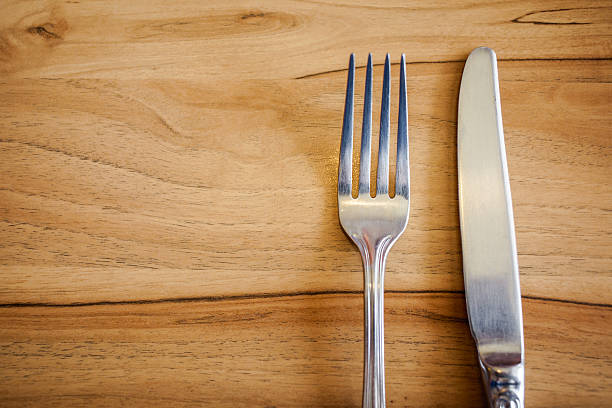 istock Knife and fork set on a wooden table 509304060