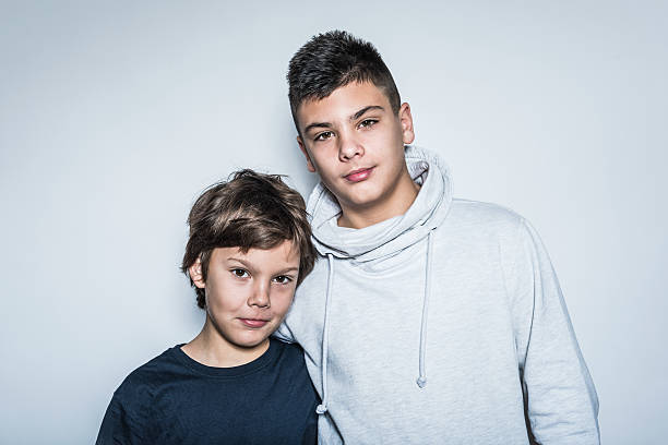 Two Cute Looking Kid  Brothers Two Cute Looking Kid  Brothers Portrait brother stock pictures, royalty-free photos & images