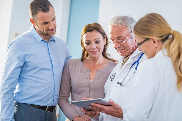 istock Patients and doctors examining test results on a digital tablet 509305160