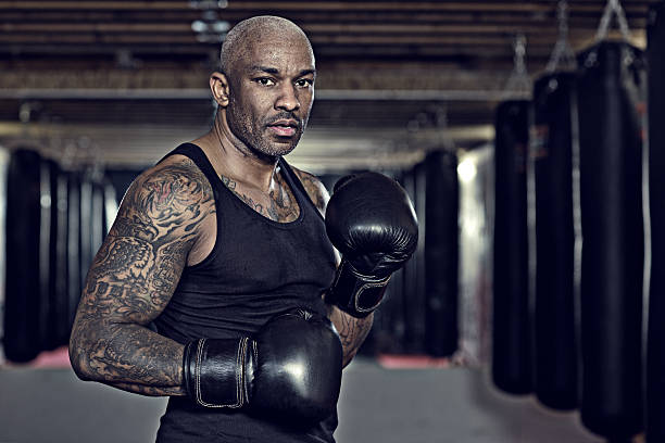 istock Middle aged black man at an urban styled boxing gym 509305358