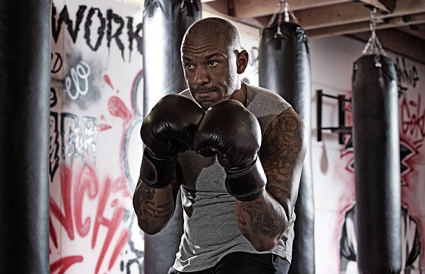 istock Middle aged black man at an urban styled boxing gym 509305422