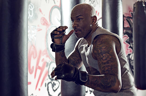 istock Middle aged black man at an urban styled boxing gym 509305482