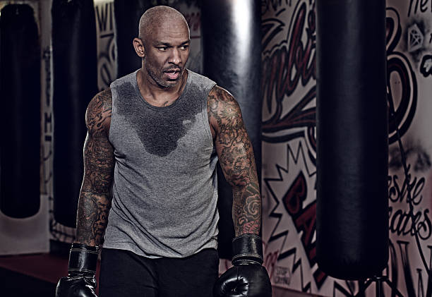 istock Middle aged black man at an urban styled boxing gym 509305682