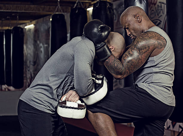 istock Two fighters sparring at an urban boxing gym 509305700