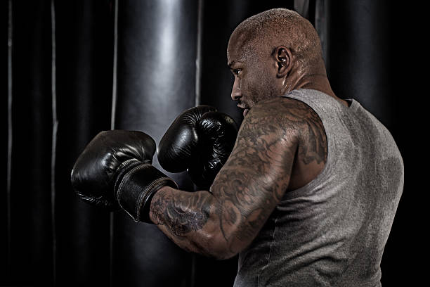 istock Middle aged black man at an urban styled boxing gym 509305824