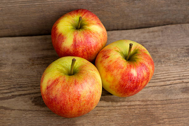 istock Red apples on wooden background 509307062