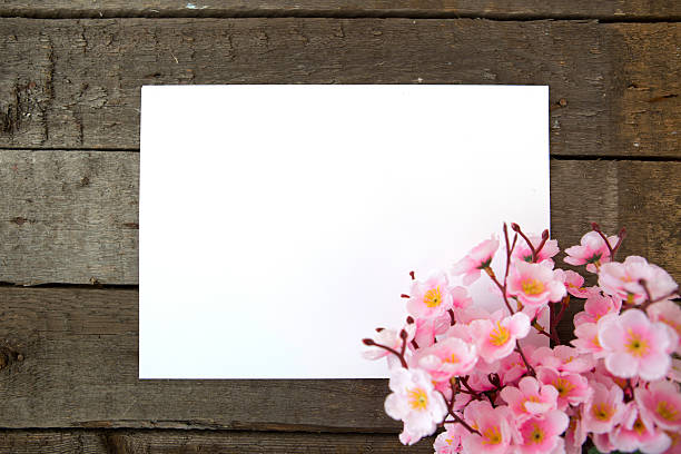istock Sakura, paper and wooden background 509307450