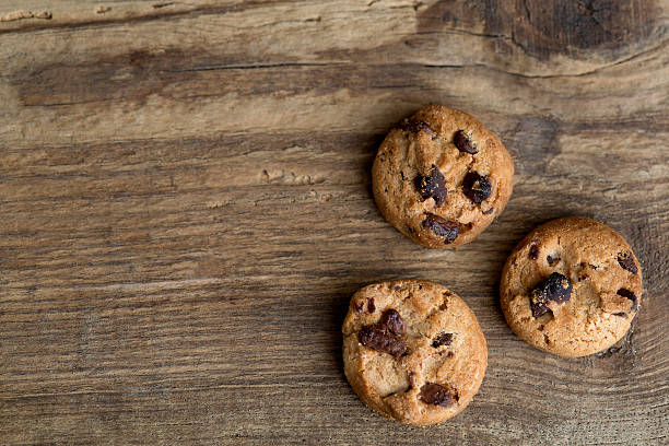 istock Brown cookies on wooden background 509307578