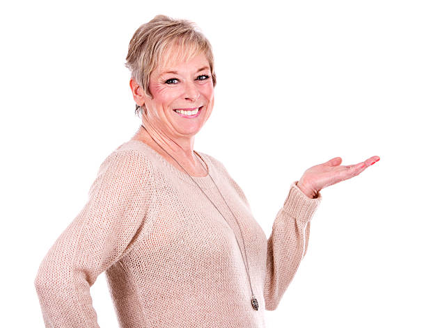 istock casual mature woman pointing 509308512