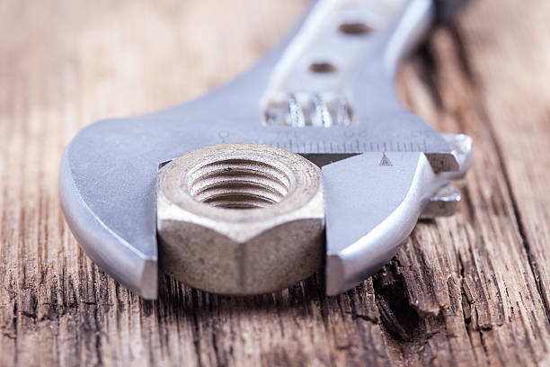 istock wrench background on grungy wood surface 509309484