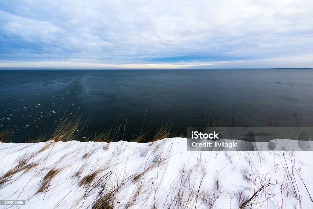 Nature forming Estonian flag Coastal cliffs near Paldiski city in Estonia forming Estonian flag in the nature. At The Edge Of Stock Photo