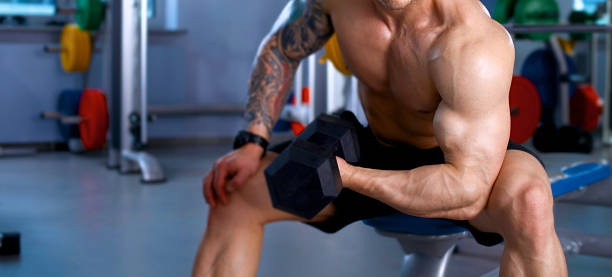 istock Young handsome man sits after workout in the gym 509310154