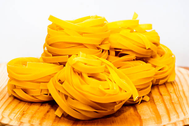 Italian noodle nest on wooden