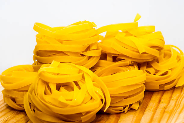 Italian noodle nest on wooden