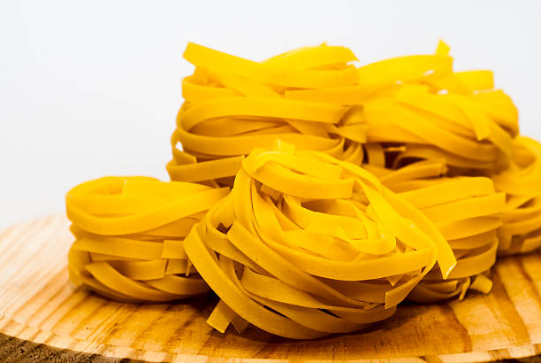 Italian noodle nest on wooden