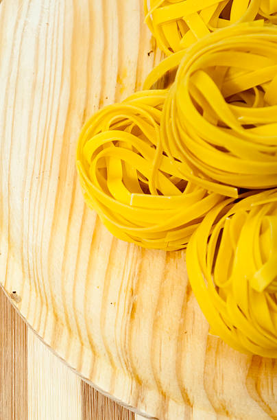 Italian noodle nest on wooden