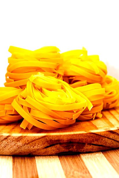 Italian noodle nest on wooden